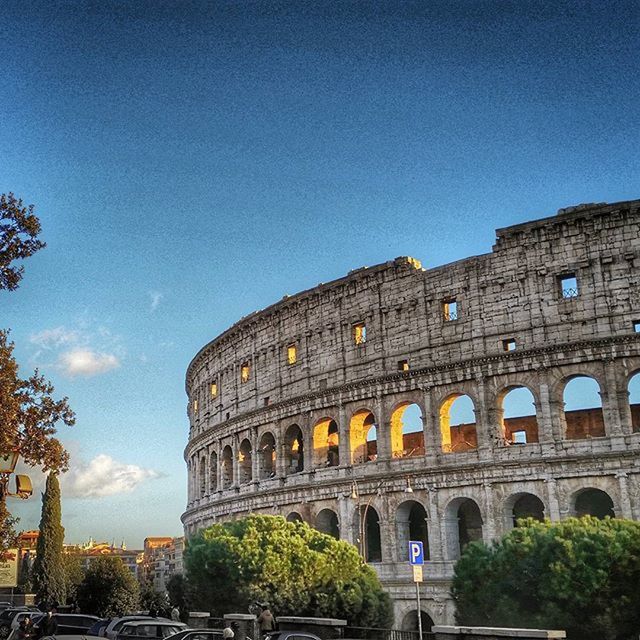 architecture, built structure, building exterior, history, low angle view, famous place, travel destinations, arch, tourism, old ruin, international landmark, the past, travel, clear sky, ancient, old, culture, sky, coliseum, blue