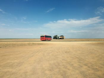 Vintage car on land against sky