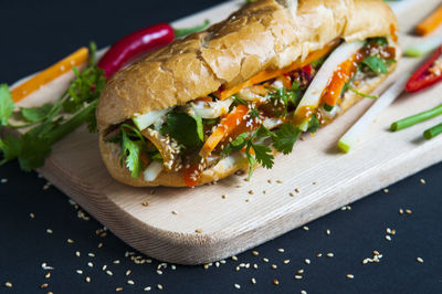 High angle view of fresh sandwich on cutting board