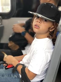 Portrait of smiling woman sitting in bus