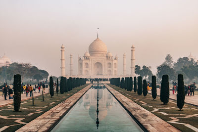 Taj mahal at foggy sunrise in winter