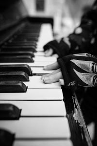 Close-up of man playing piano