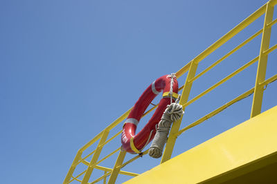 A lifebuoy ring with rope at the back of ferry boat - travel and shipping safety background