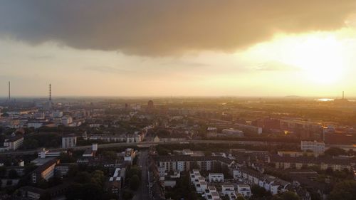 High angle view of townscape against sky at sunset