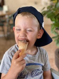 Portrait of smiling young woman holding ice cream cone