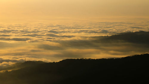 Scenic view of silhouette mountain against sky during sunset