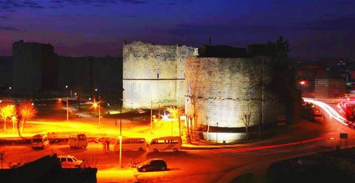 View of illuminated road at night