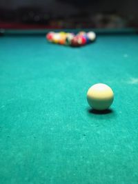 Close-up of cue ball on pool table