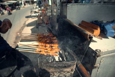 High angle view of person preparing food, sate indonesian food