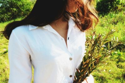 Woman standing on grass