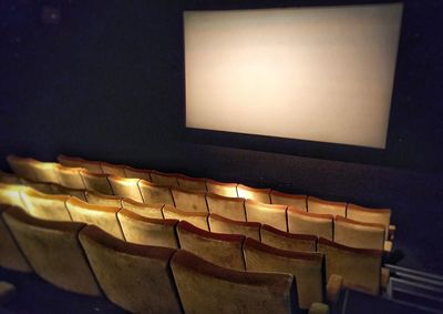 High angle view of empty chairs in theater