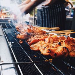 Close-up of meat on barbecue grill