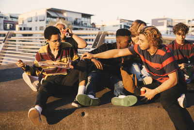 People sitting in front of buildings