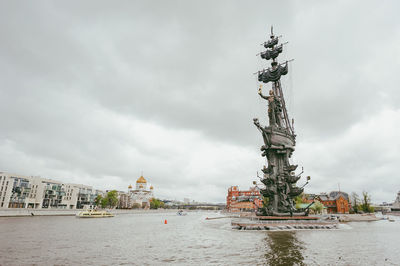 Statue of liberty against cloudy sky