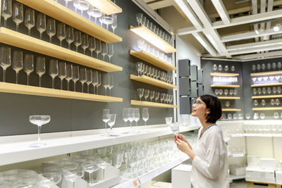 Side view of woman shopping in mall