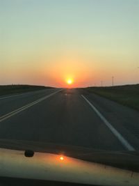 Road against sky during sunset