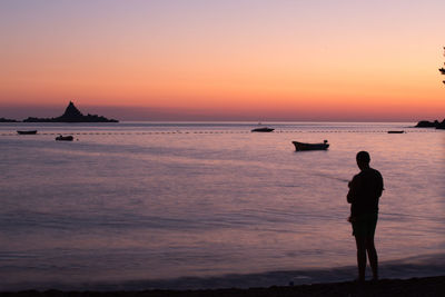 Scenic view of sea at sunset