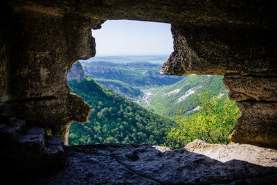 Scenic view of mountain seen through arch