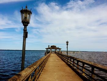 Pier over sea against sky