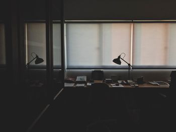 Empty chairs and table in room