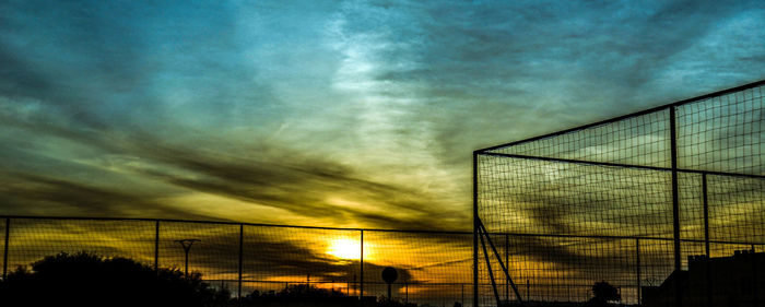 Low angle view of cloudy sky at sunset