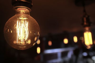 Close-up of illuminated light bulb