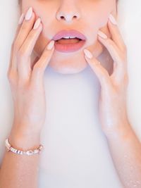 Close-up of human hand against white background