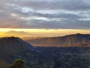 Scenic view of mountains against sky during sunset