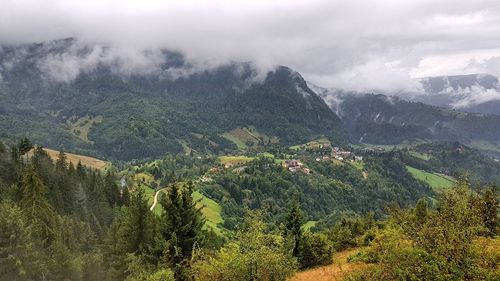 Scenic view of tree mountains against sky