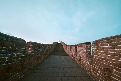 Distant view of man standing on great wall of china