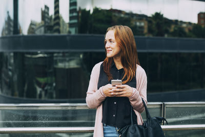 Young woman holding coffee cup