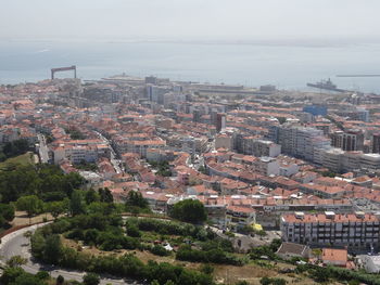 High angle view of buildings in city against sky