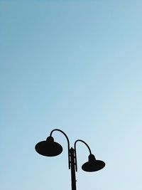 Low angle view of street light against clear sky