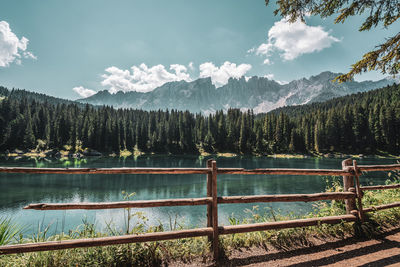 Lake carezza, view on the lake with the latemar range in the background. italy.