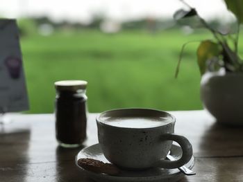 Close-up of coffee cup on table