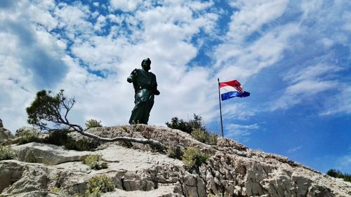 Low angle view of statue against sky