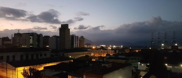 High angle view of illuminated buildings in city at night