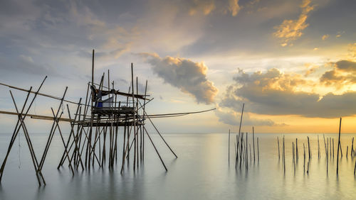 Scenic view of sea against cloudy sky