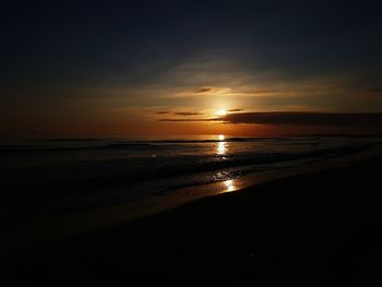 View of beach at sunset