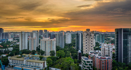 Aerial view of cityscape against sky during sunset