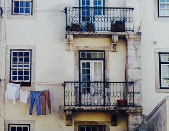 Clothes drying on balcony of house