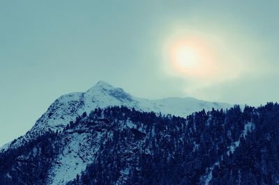 Scenic view of snowcapped mountains against clear sky