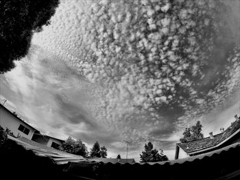 Low angle view of building against cloudy sky