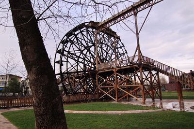 Abandoned amusement park against sky