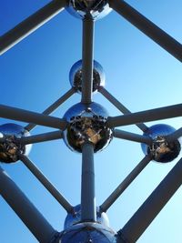 Low angle view of communications tower against sky