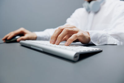 Midsection of businessman sitting office