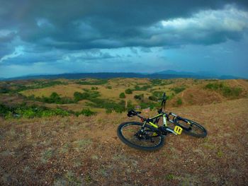 Scenic view of landscape against cloudy sky