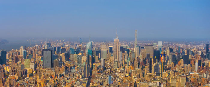 Aerial view of cityscape against clear sky