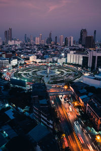 High angle view of illuminated buildings in city at night