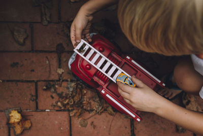 Close-up of boy playing with toy